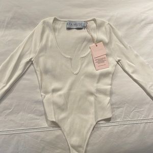 Never worn with tags size XS Aya Muse white cutout knit bodysuit
